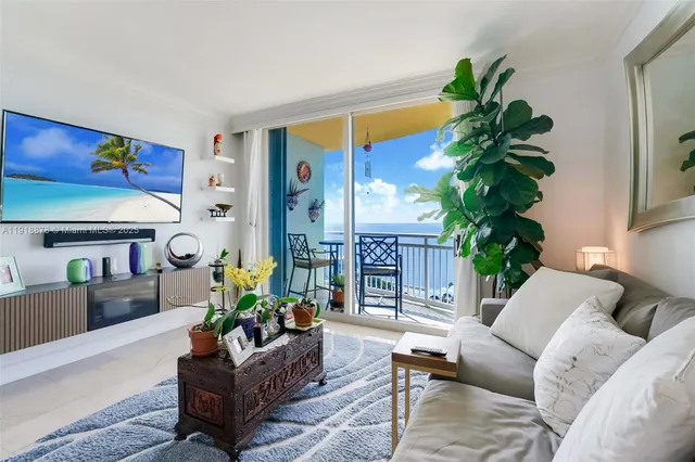 a living room with furniture potted plant and a window