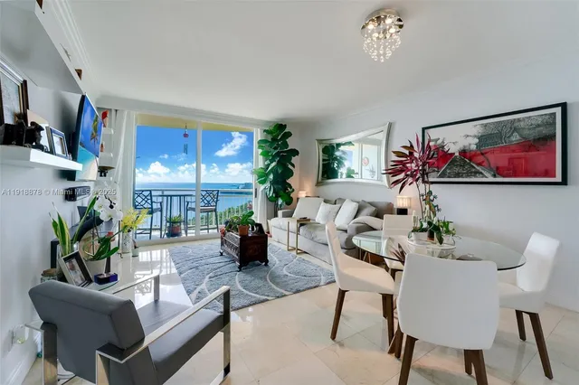 a living room with furniture flower pot and a fireplace