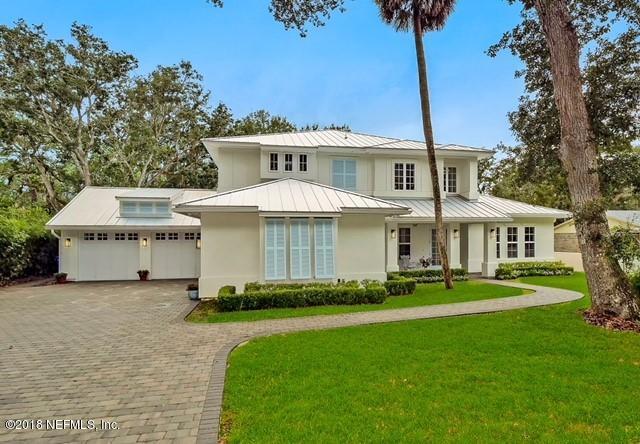 1161 Neck Road Ponte Vedra Beach, FL 32082 - Photo 1 of 24 a front view of a house with a garden