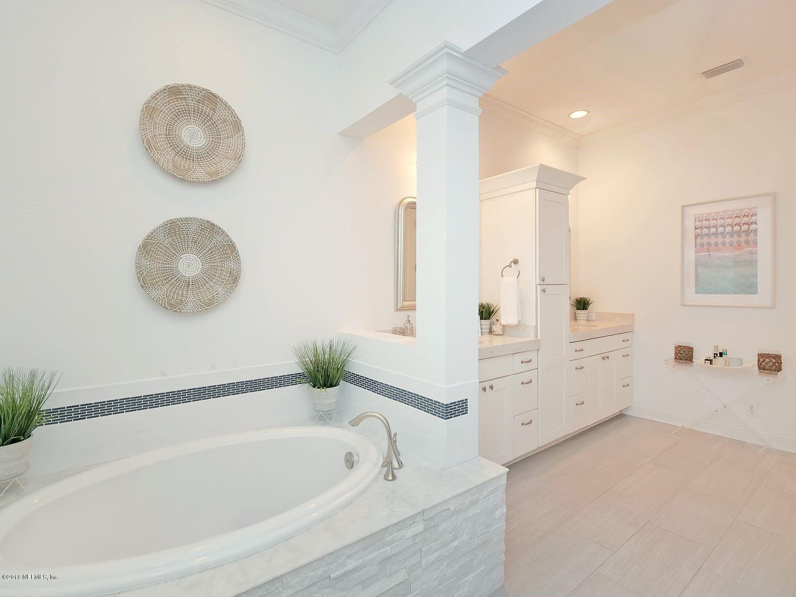 1161 Neck Road Ponte Vedra Beach, FL 32082 - Photo 15 of 24 a bathroom with a tub sink and mirror