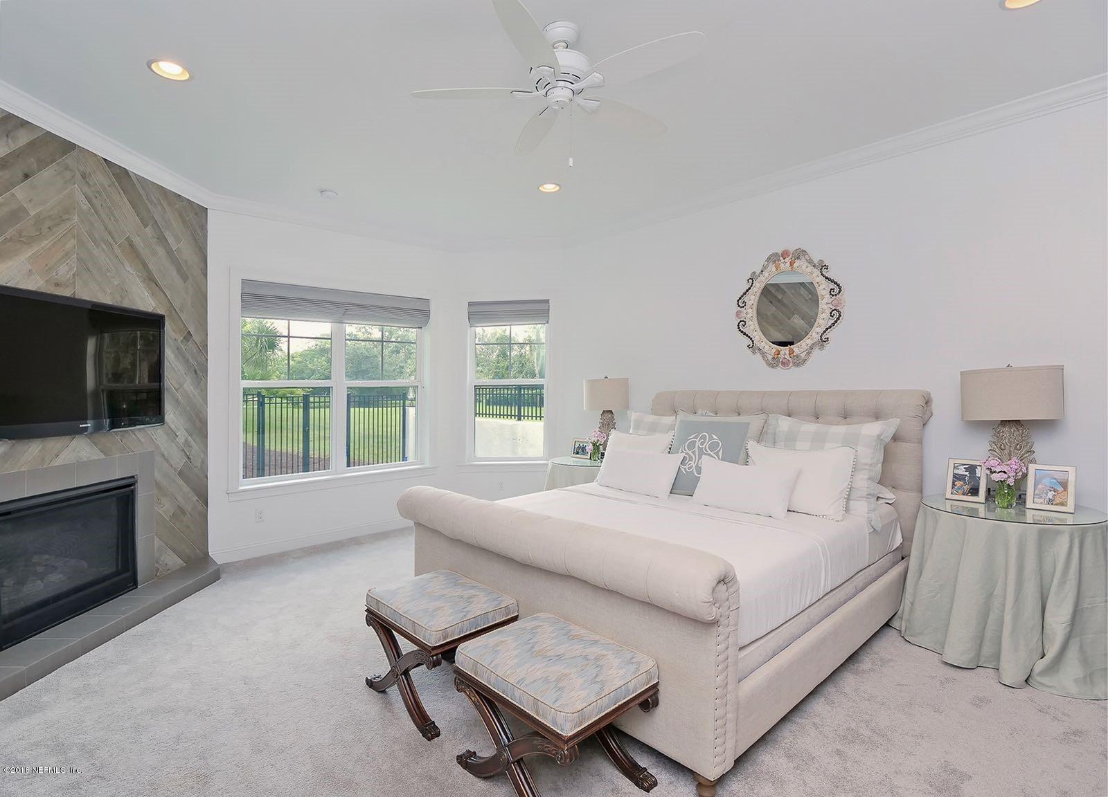 1161 Neck Road Ponte Vedra Beach, FL 32082 - Photo 16 of 24 a bedroom with a bed and a fireplace