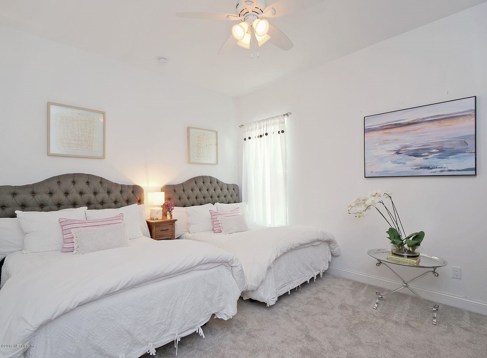 1161 Neck Road Ponte Vedra Beach, FL 32082 - Photo 17 of 24 a bedroom with bed and a chandelier