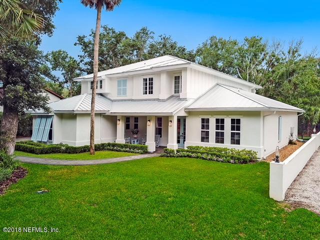 1161 Neck Road Ponte Vedra Beach, FL 32082 - Photo 2 of 24 a front view of a house with a garden and trees
