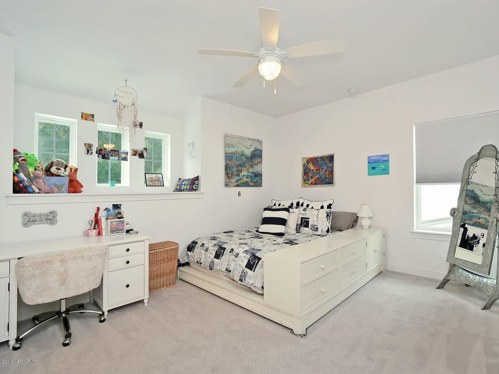1161 Neck Road Ponte Vedra Beach, FL 32082 - Photo 21 of 24 a room with a bed and a couch