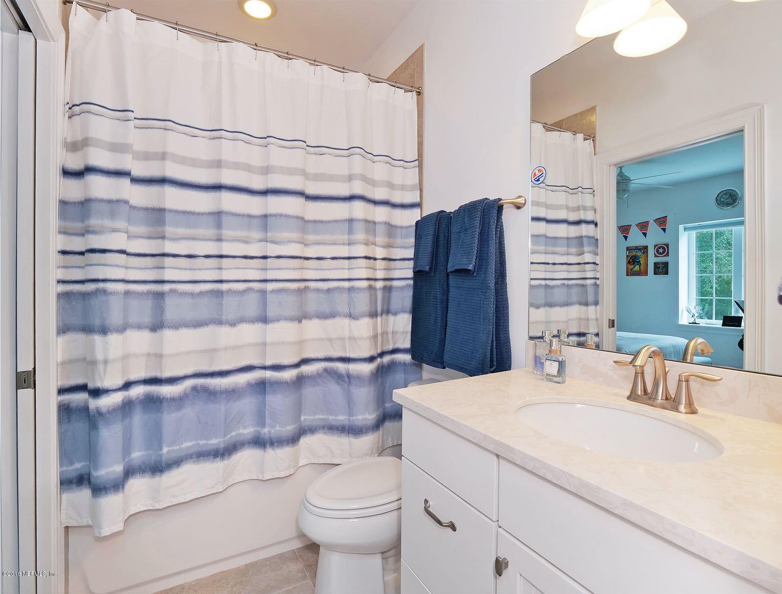 1161 Neck Road Ponte Vedra Beach, FL 32082 - Photo 22 of 24 a bathroom with a sink a toilet and shower