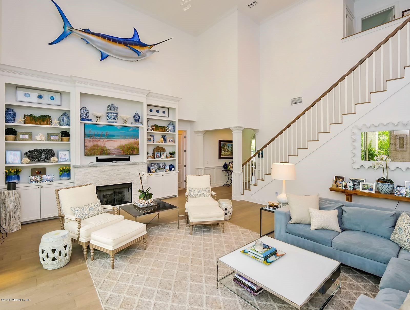 1161 Neck Road Ponte Vedra Beach, FL 32082 - Photo 5 of 24 a living room with furniture fireplace and a flat screen tv