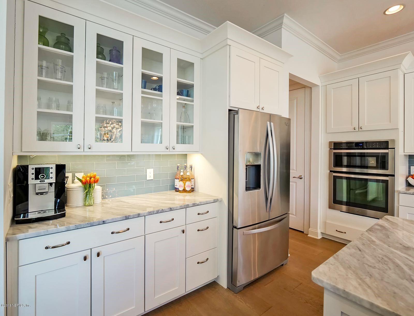 1161 Neck Road Ponte Vedra Beach, FL 32082 - Photo 6 of 24 a kitchen with stainless steel appliances a refrigerator sink and cabinets