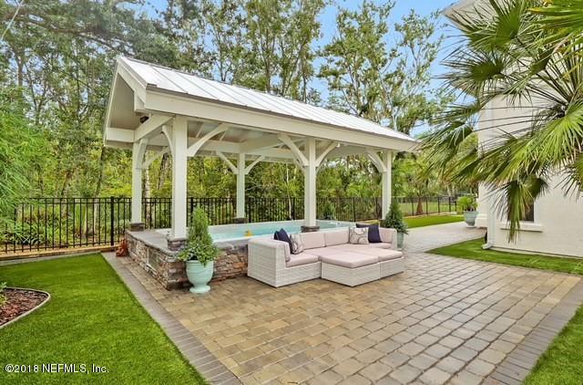 1161 Neck Road Ponte Vedra Beach, FL 32082 - Photo 9 of 24 a backyard of a house with fountain table and chairs