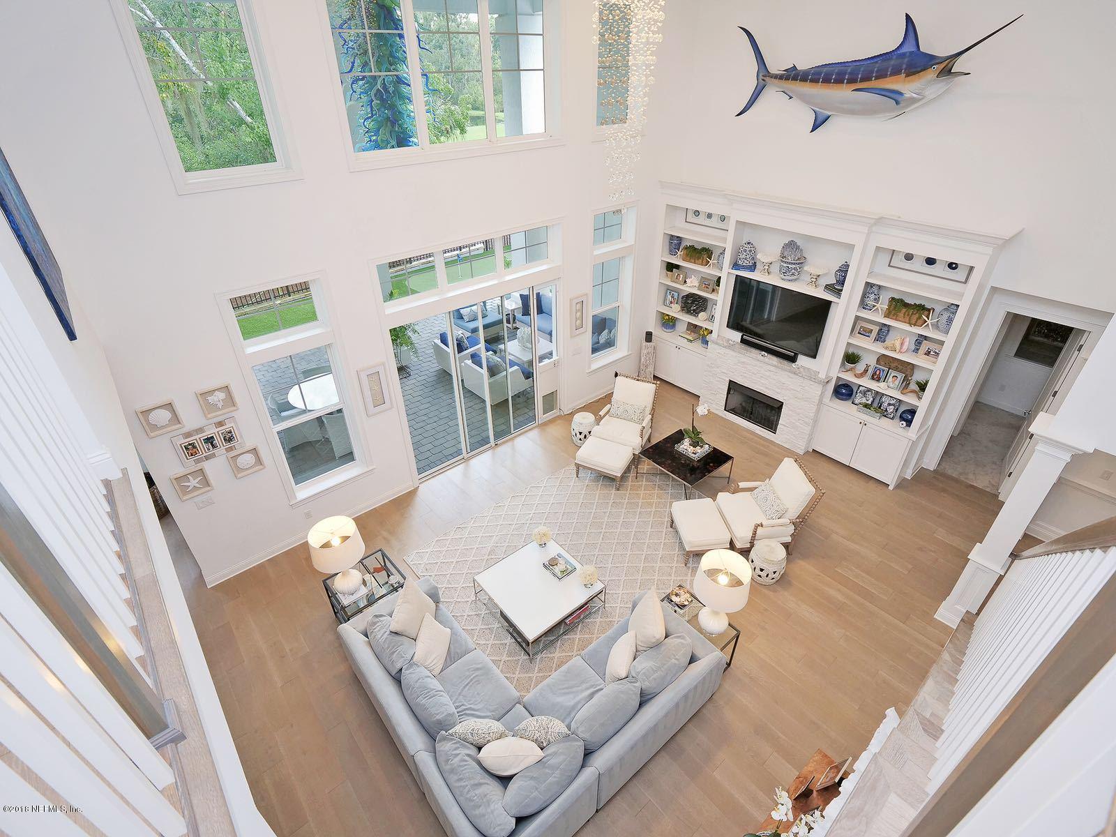 1161 Neck Road Ponte Vedra Beach, FL 32082 - Photo 10 of 24 a living room with white furniture and wooden floor