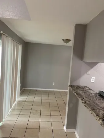 an empty room with a wooden floor