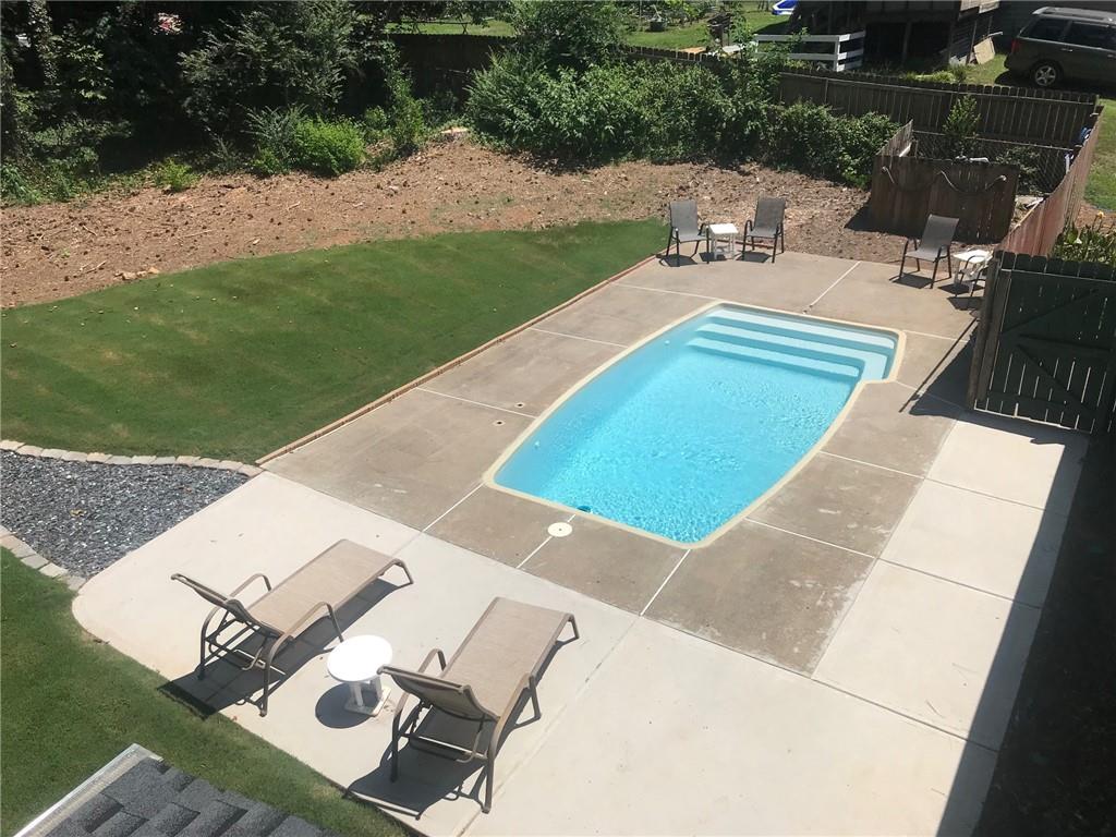 302 Independence Way Woodstock, GA 30188 - Photo 5 of 65 View of swimming pool featuring a patio area