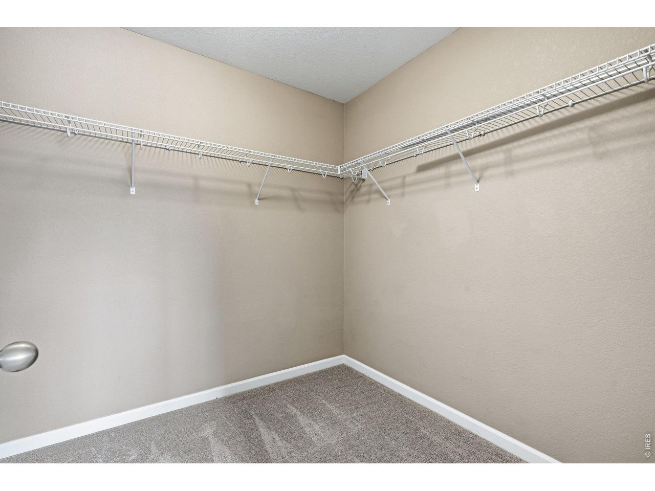 1277 Mathews Way Erie, CO 80516 - Photo 18 of 40 a view of a room with racks on the wall