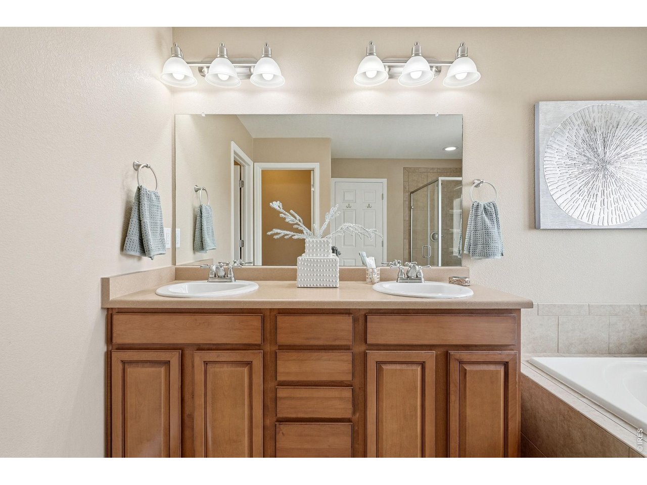 1277 Mathews Way Erie, CO 80516 - Photo 20 of 40 a bathroom with a sink and a mirror