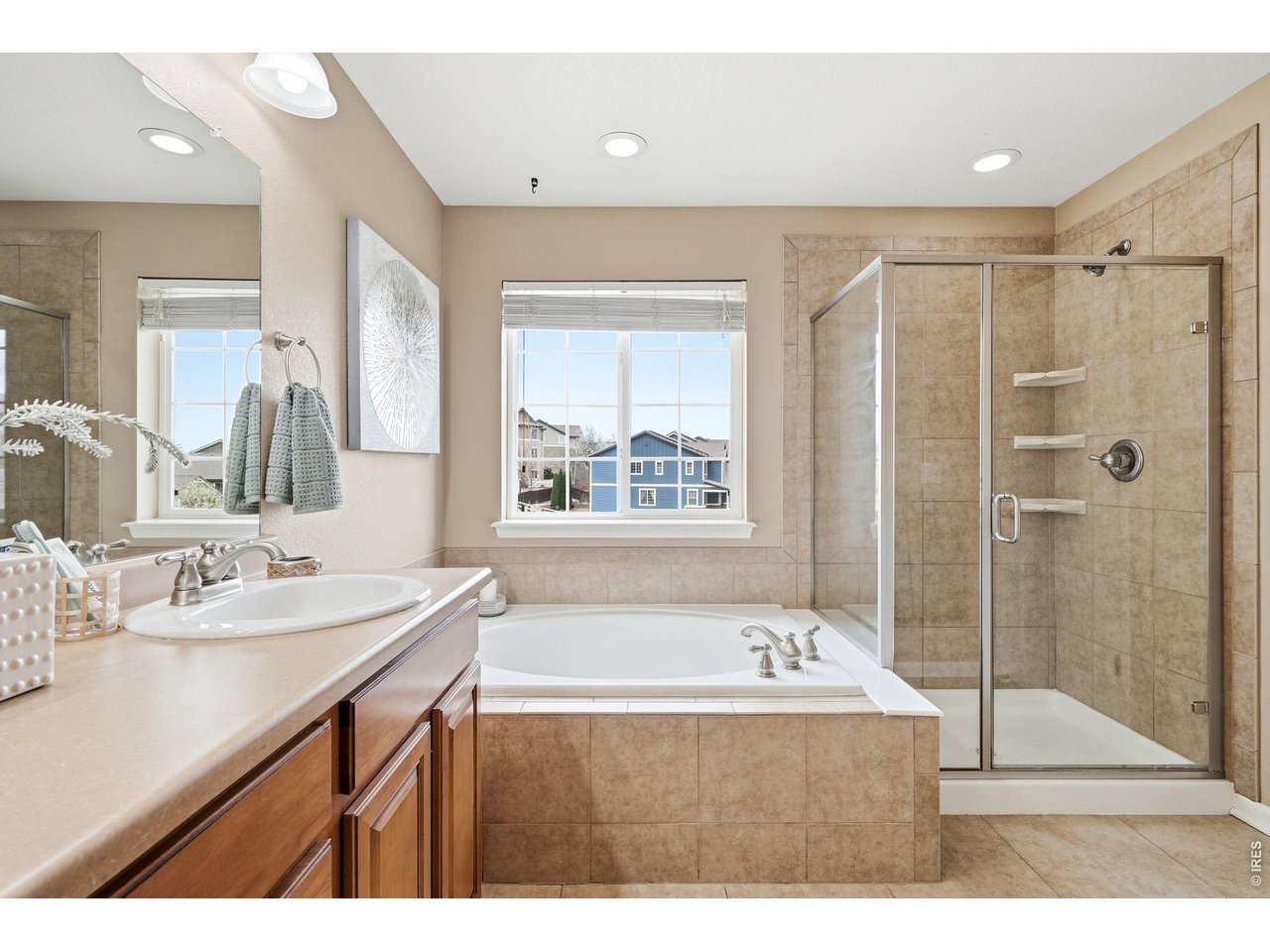 1277 Mathews Way Erie, CO 80516 - Photo 21 of 40 a bathroom with a tub a sink and a shower