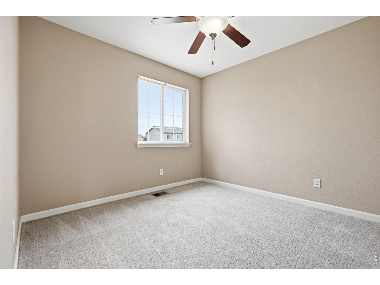 1277 Mathews Way Erie, CO 80516 - Photo 22 of 40 a view of an empty room with a window