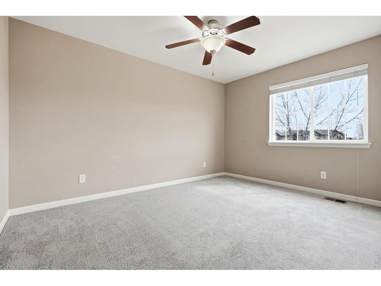 1277 Mathews Way Erie, CO 80516 - Photo 24 of 40 a view of an empty room with a window