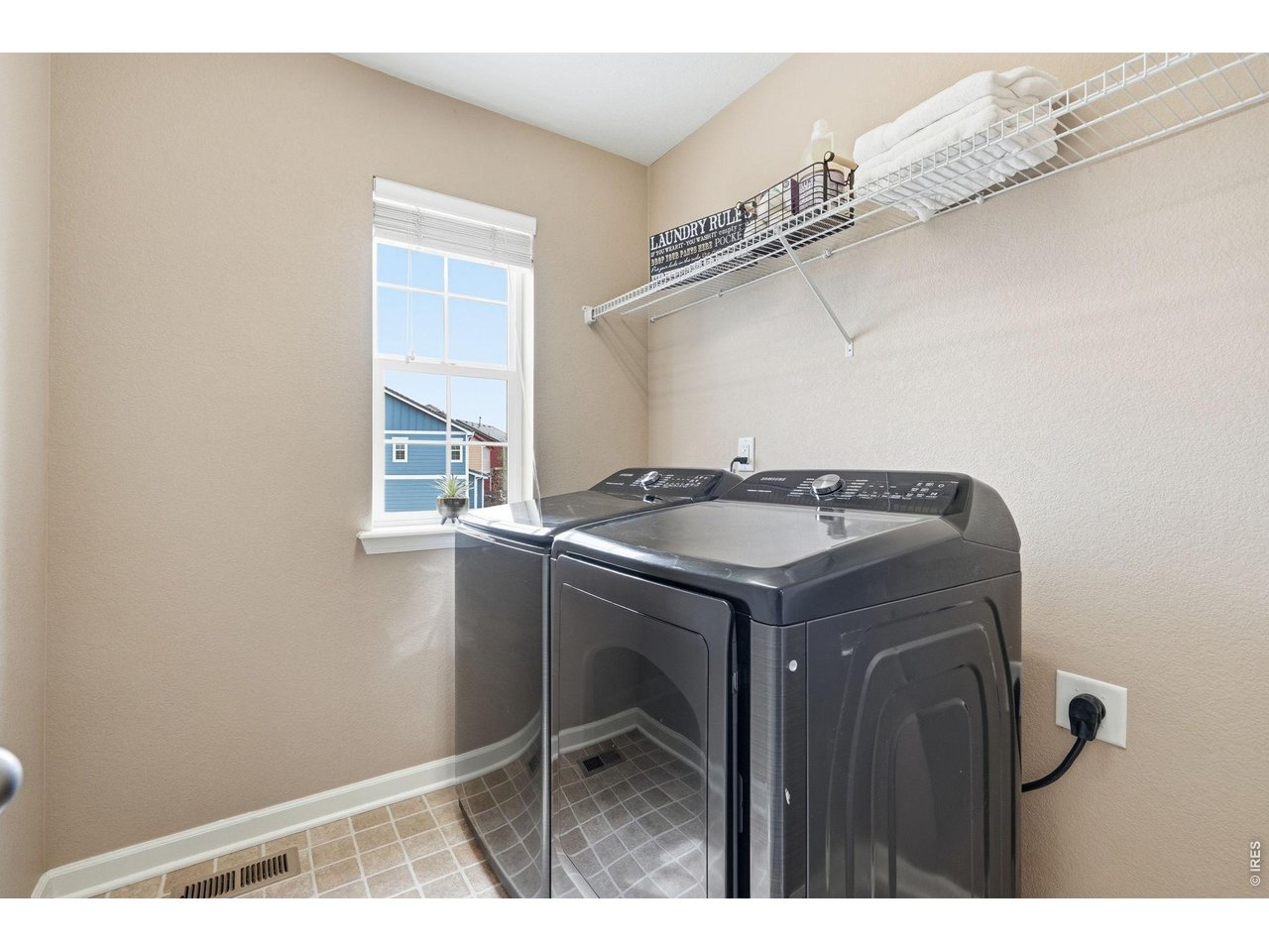 1277 Mathews Way Erie, CO 80516 - Photo 27 of 40 a utility room with dryer and washer