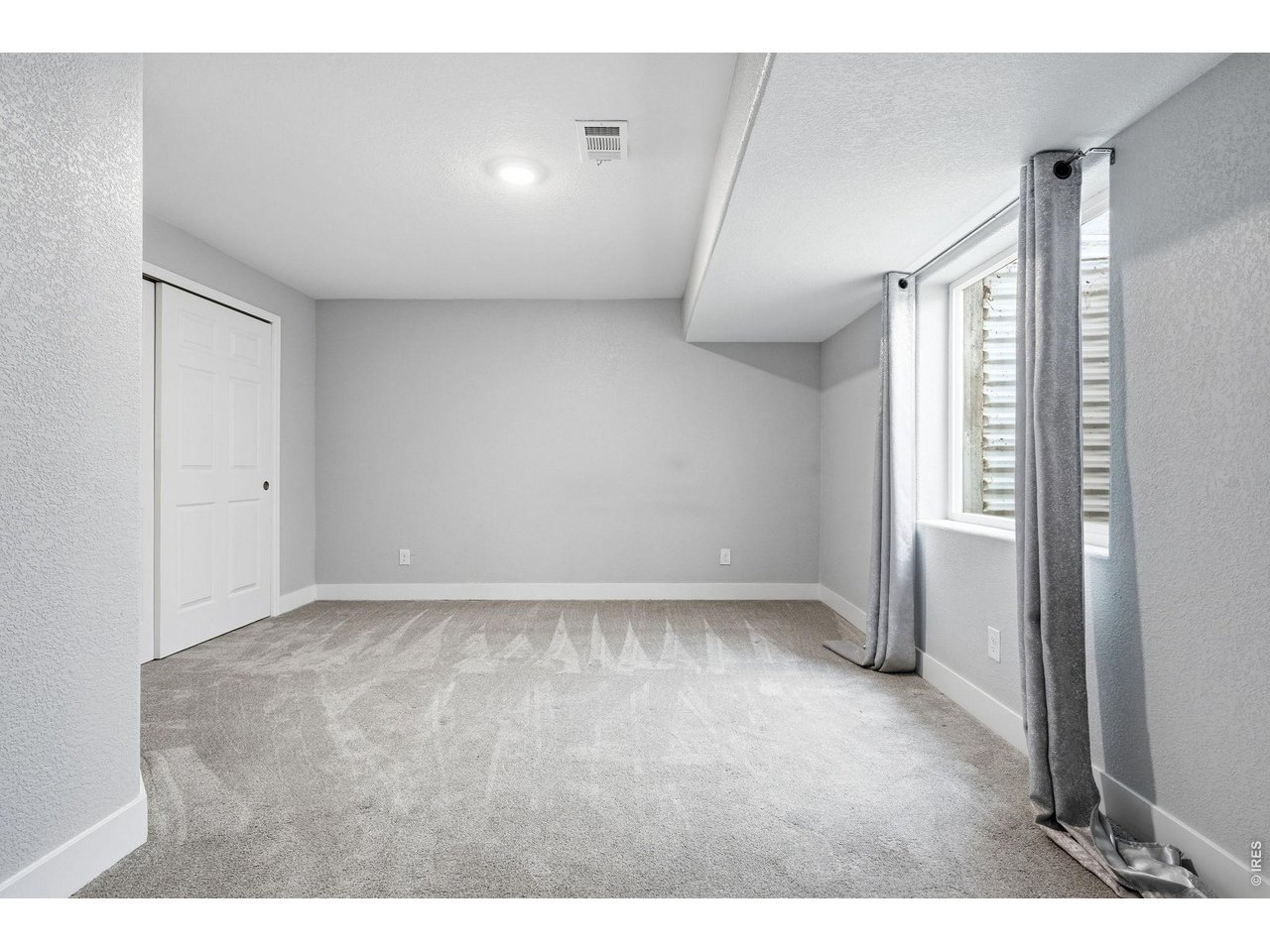 1277 Mathews Way Erie, CO 80516 - Photo 30 of 40 a view of an empty room and window