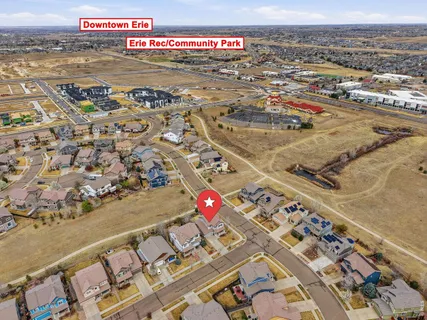 an aerial view of residential houses with outdoor space