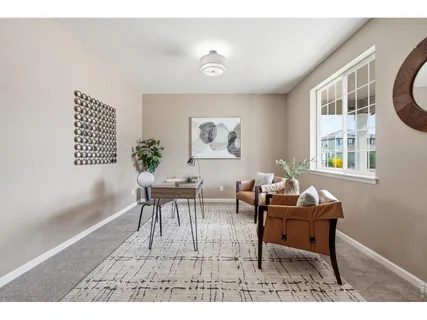 a dining room with furniture and window