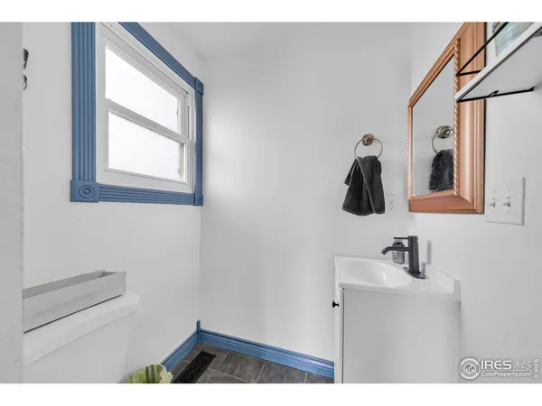 a bathroom with a sink and mirror