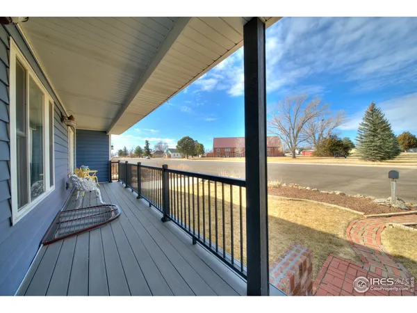 a view of balcony with wooden floor