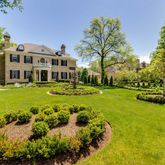 a front view of a building with garden