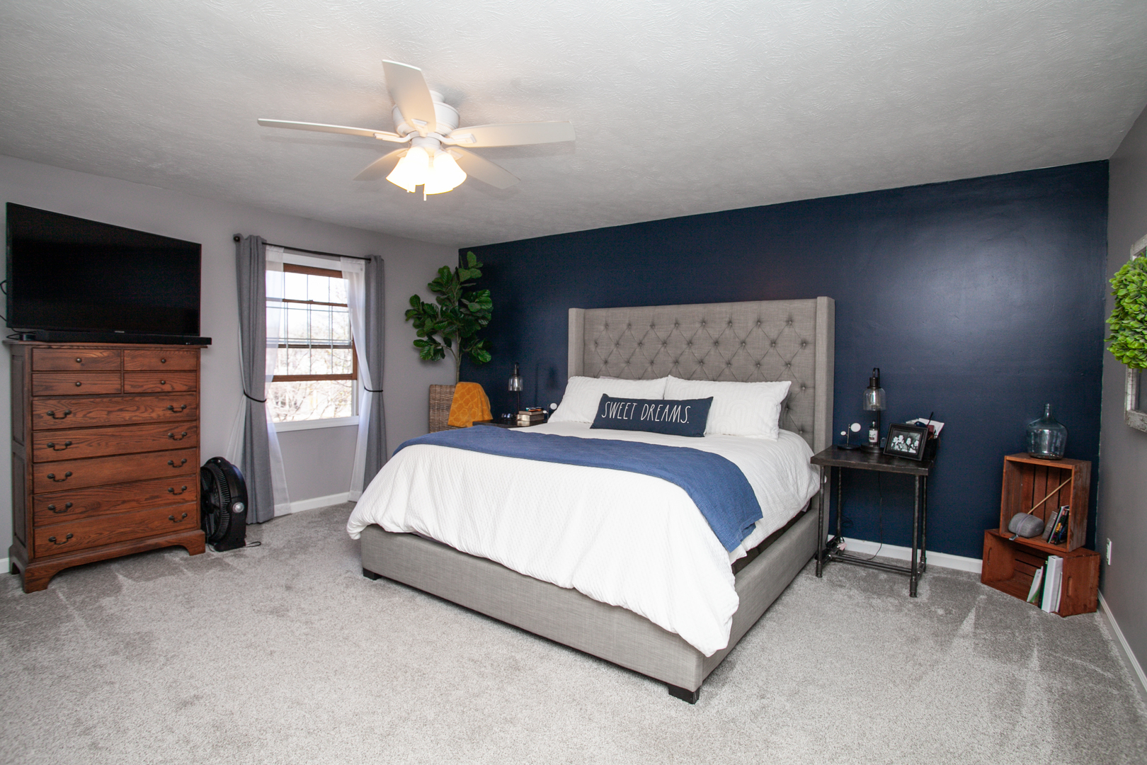 1308 Mill Creek Road Bloomington, IL 61704 - Photo 15 of 26 a bed room with a bed and a television