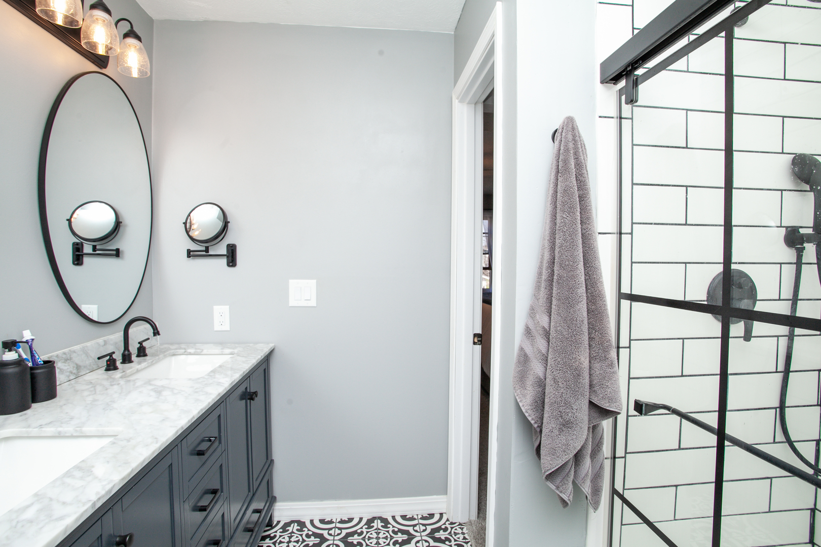 1308 Mill Creek Road Bloomington, IL 61704 - Photo 16 of 26 a bathroom with a granite countertop sink and a mirror