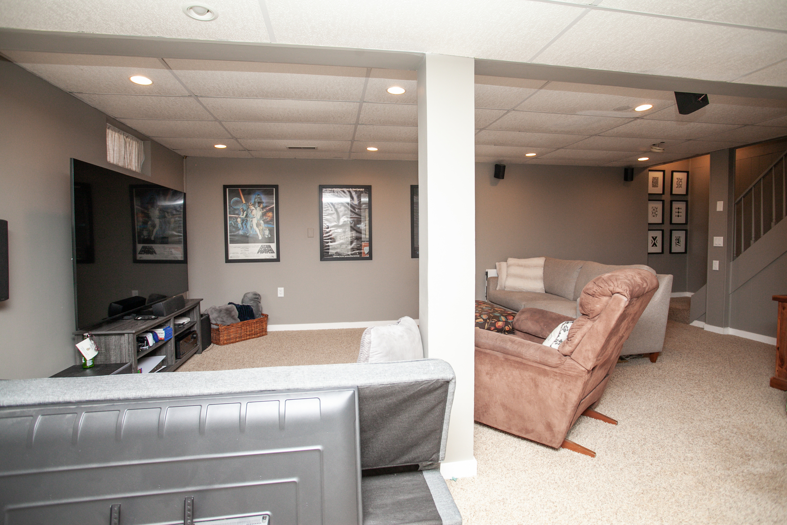 1308 Mill Creek Road Bloomington, IL 61704 - Photo 25 of 26 a living room with furniture and a flat screen tv
