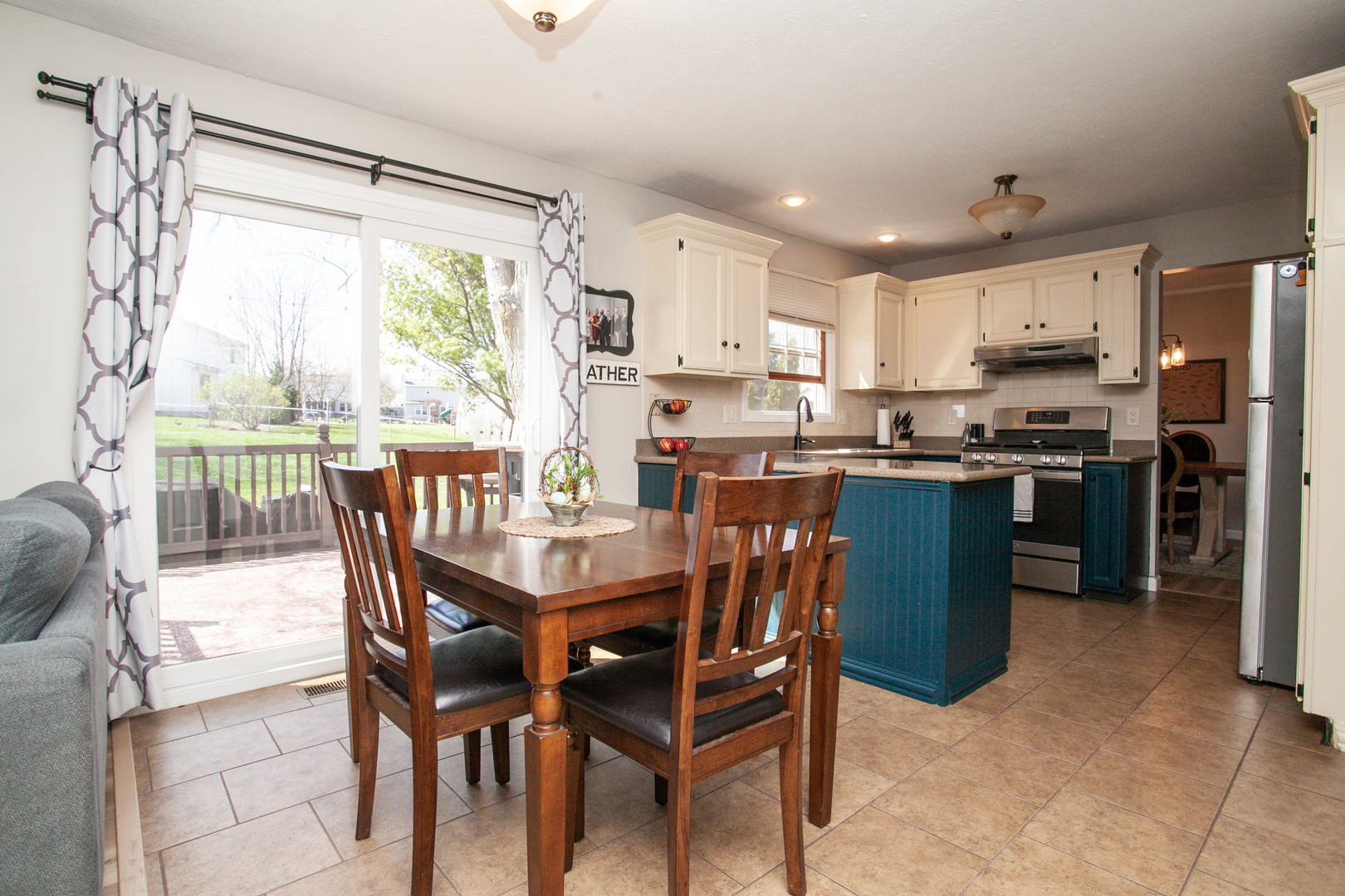 1308 Mill Creek Road Bloomington, IL 61704 - Photo 6 of 26 a dining room with stainless steel appliances granite countertop a table and chairs