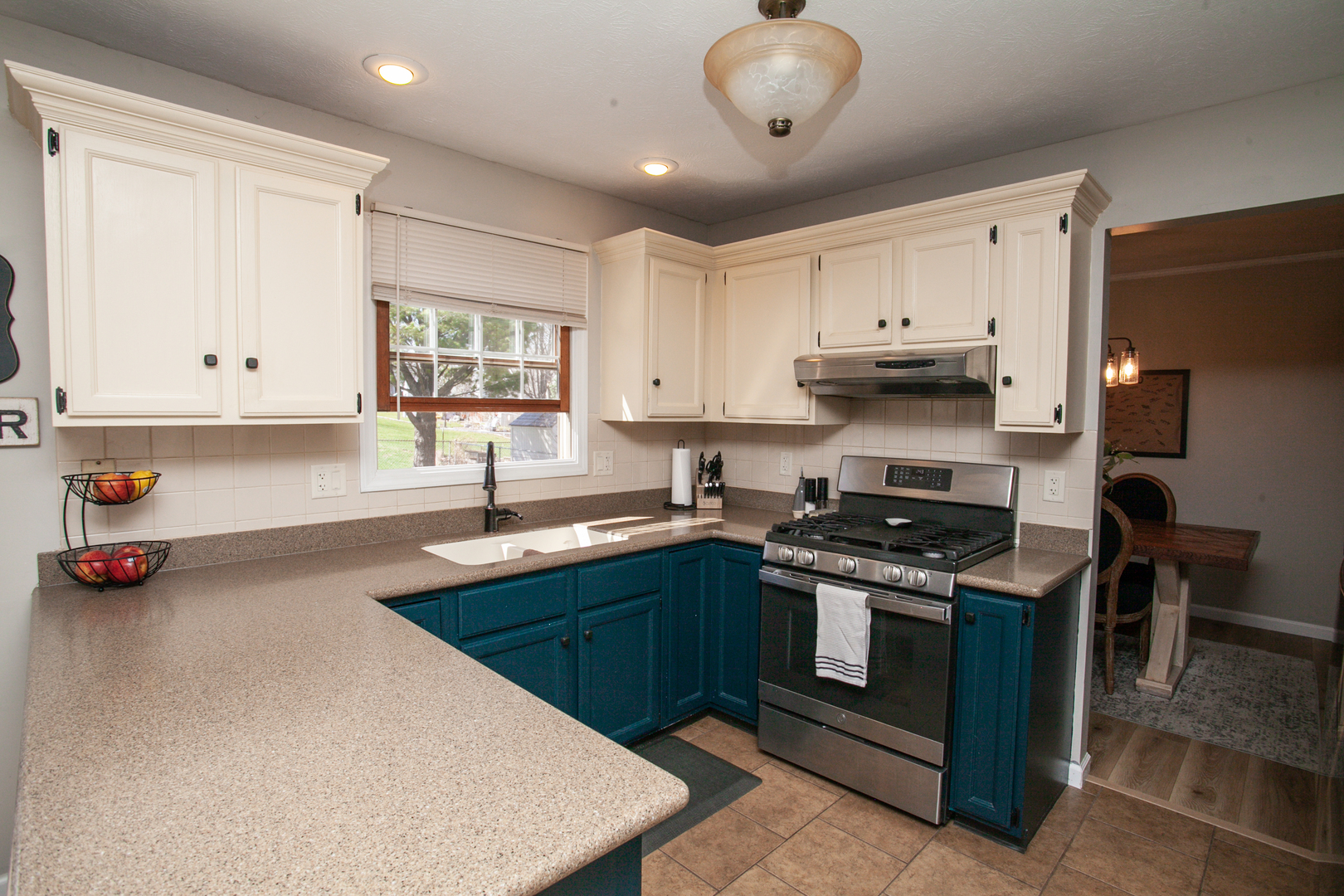 1308 Mill Creek Road Bloomington, IL 61704 - Photo 8 of 26 a kitchen with stainless steel appliances granite countertop a stove a sink and a refrigerator