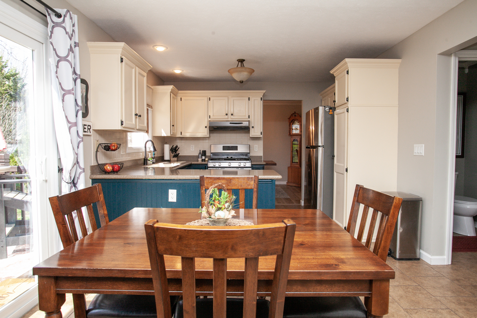 1308 Mill Creek Road Bloomington, IL 61704 - Photo 9 of 26 a view of a dining room with furniture