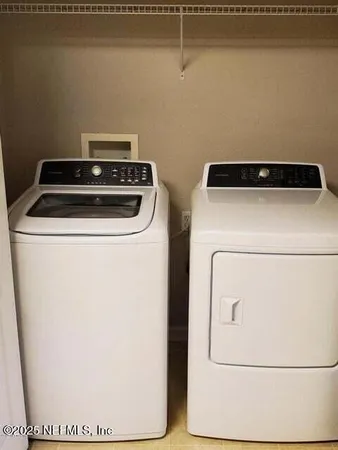 a utility room with dryer and washer