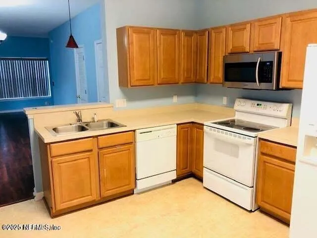 a utility room with washer and dryer