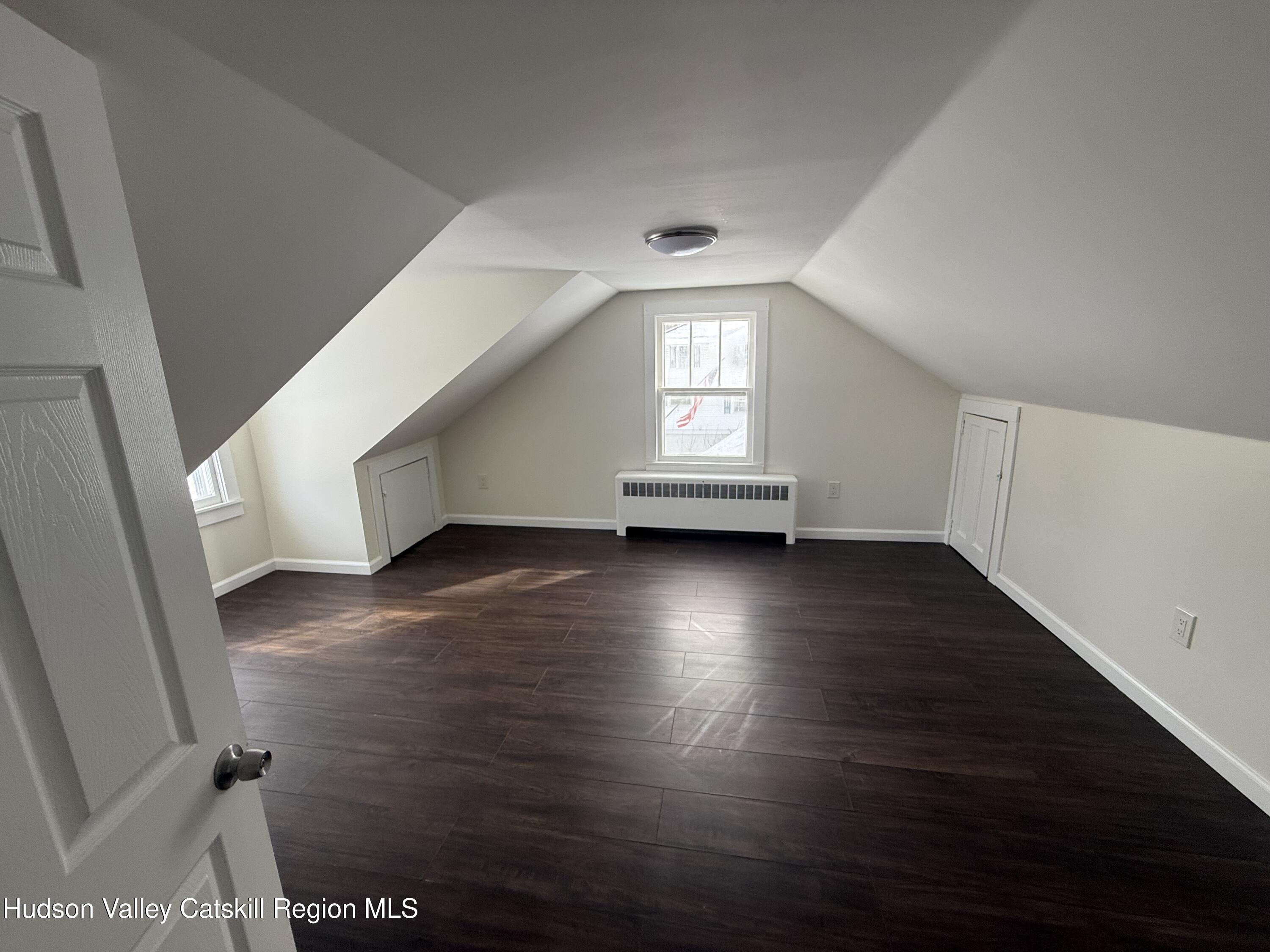 222 Zandhoek Road Hurley, NY 12443 - Photo 12 of 23 an empty room with wooden floor and windows