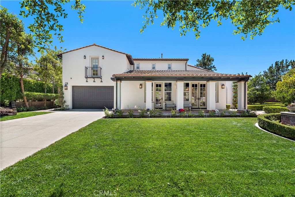 a front view of house with yard and trees