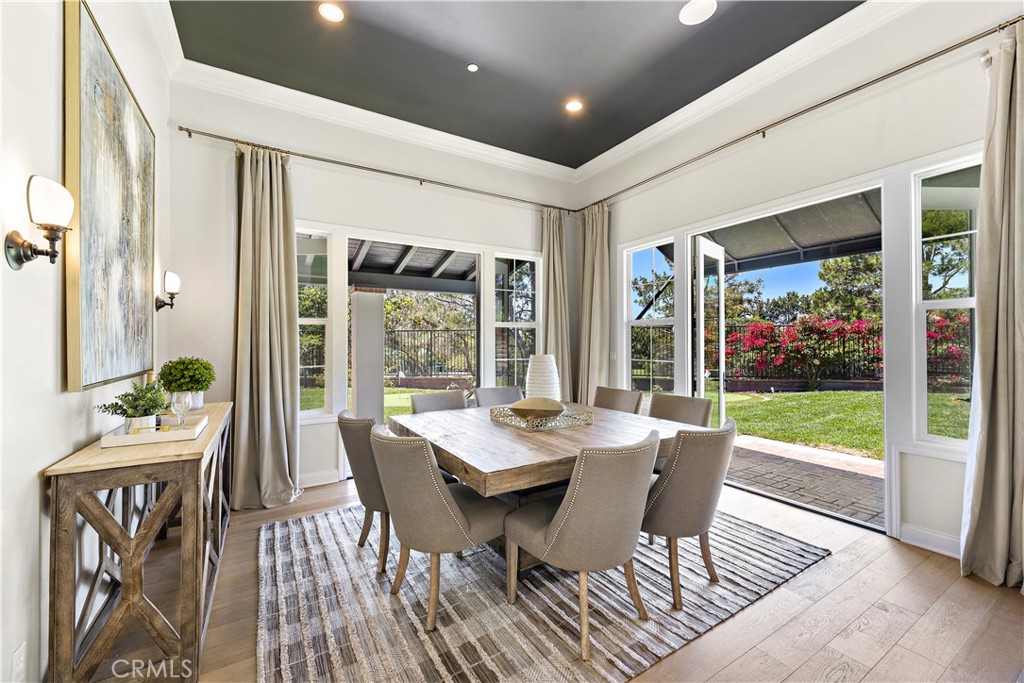 2 Anna Lane Ladera Ranch, CA 92694 - Photo 16 of 63 a dining room with furniture large windows and wooden floor
