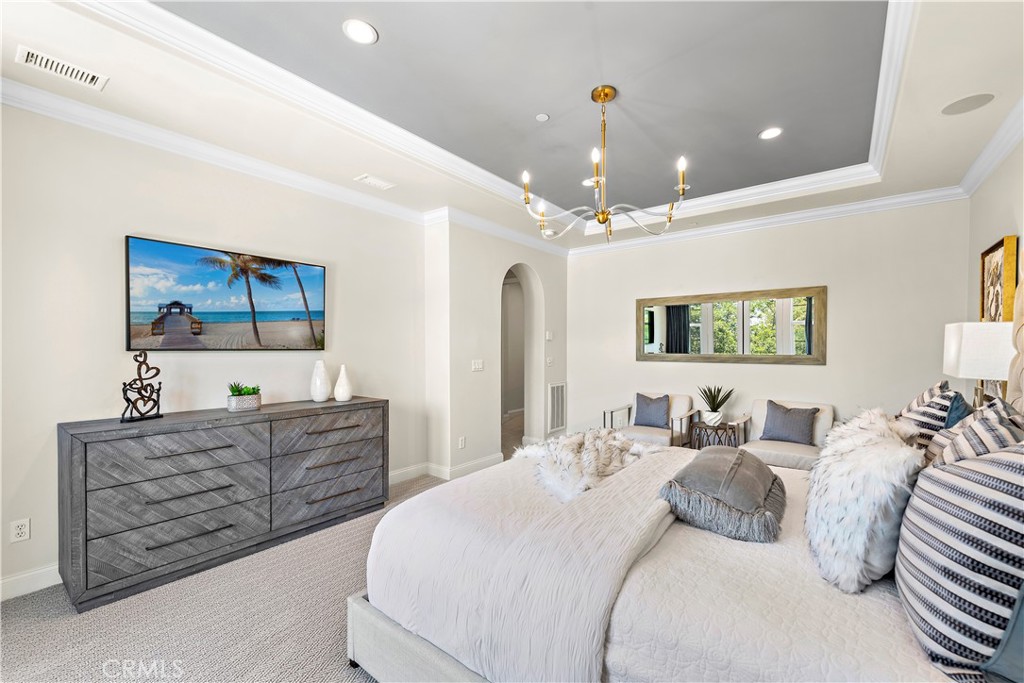 2 Anna Lane Ladera Ranch, CA 92694 - Photo 19 of 63 a spacious bedroom with a bed a dresser and mirror