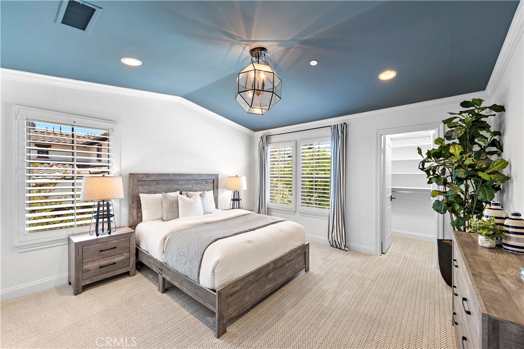 2 Anna Lane Ladera Ranch, CA 92694 - Photo 25 of 63 a bedroom with a bed and a chandelier