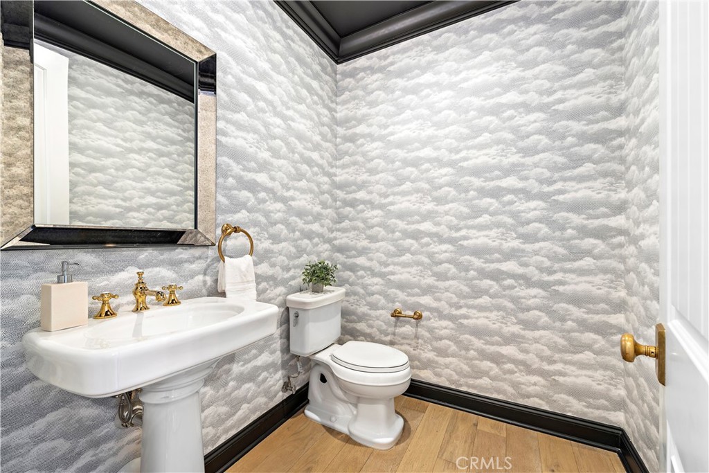 2 Anna Lane Ladera Ranch, CA 92694 - Photo 28 of 63 a bathroom with a sink a toilet and mirror