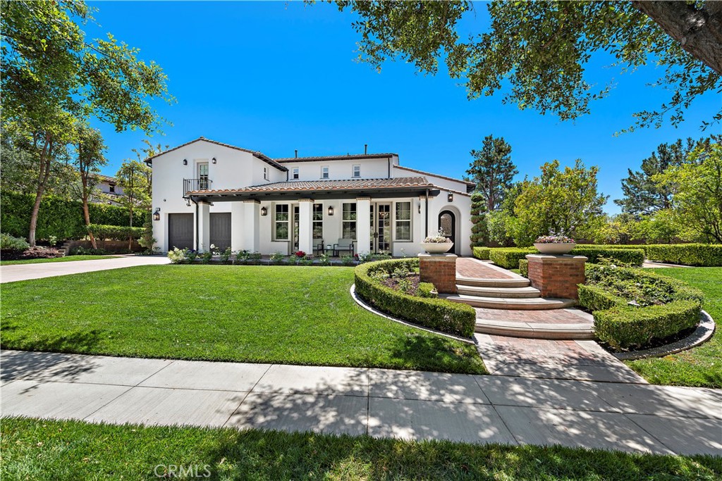 2 Anna Lane Ladera Ranch, CA 92694 - Photo 42 of 63 a front view of a house with a garden and yard