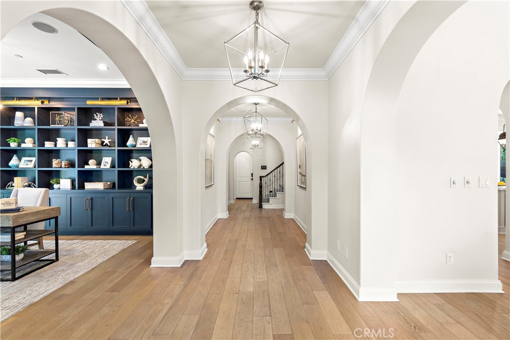 2 Anna Lane Ladera Ranch, CA 92694 - Photo 8 of 63 a view of a hallway with wooden floor and staircase