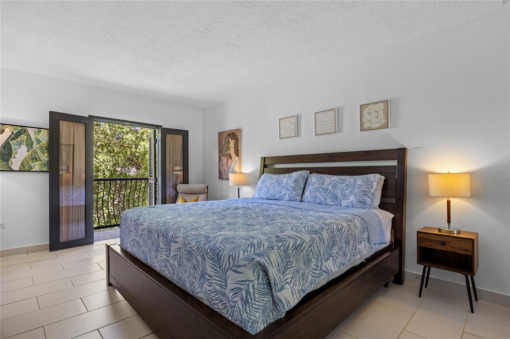 2066 Montesol, Unit 2066 Humacao, PR 00792 - Photo 12 of 29 a bedroom with a bed and a lamp