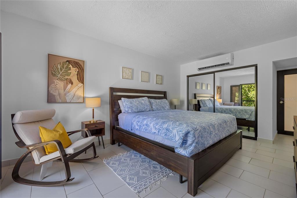 2066 Montesol, Unit 2066 Humacao, PR 00792 - Photo 14 of 29 a bedroom with a bed chair and window