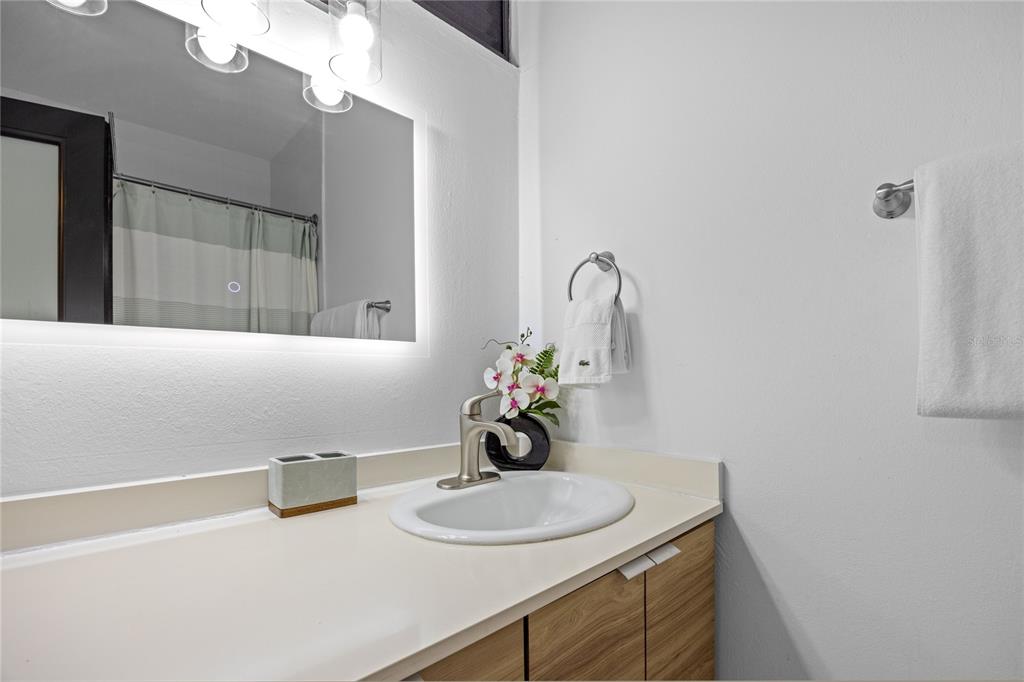 2066 Montesol, Unit 2066 Humacao, PR 00792 - Photo 23 of 29 a bathroom with a sink vanity and a mirror