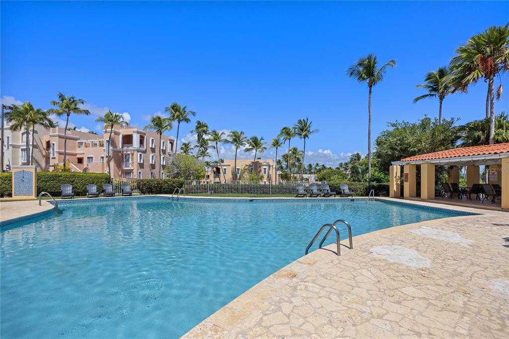 2066 Montesol, Unit 2066 Humacao, PR 00792 - Photo 24 of 29 a view of a swimming pool and a yard