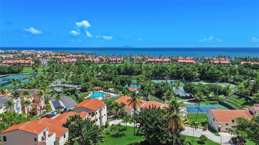 2066 Montesol, Unit 2066 Humacao, PR 00792 - Photo 28 of 29 an aerial view of a city with lots of residential buildings ocean and mountain view in back