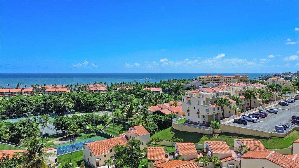 2066 Montesol, Unit 2066 Humacao, PR 00792 - Photo 29 of 29 an aerial view of a city with lots of residential buildings ocean and mountain view in back