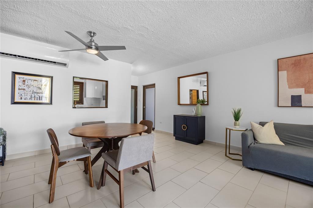 2066 Montesol, Unit 2066 Humacao, PR 00792 - Photo 4 of 29 a living room with furniture and a table